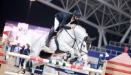 Medium Tour winner Rashid Towaim Al Marri guides Navaronne over a fence. 