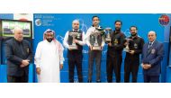 Pakistan’s Ahsan Ramzan with other podium winners and officials during the presentation ceremony, yesterday.