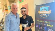 Qatar’s Abdulla Al Tamimi poses with the trophy. 