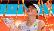 Iga Swiatek (POL) holds the Butch Buchholz Championship Trophy during the awards ceremony after her match against Naomi Osaka (JPN)(not pictured) in the women's singles final in the Miami Open at Hard Rock Stadium. Mandatory Credit: Geoff Burke-USA TODAY Sports/File Photo