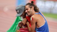 Qatar's Mutaz Essa Barshim and Gianmarco Tamberi of Italy celebrate after winning the gold medal during the Tokyo Olympics in this file photo.