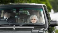 Britain's Queen Elizabeth arrives in a car to watch horses competing on the second day of the Royal Windsor Horse Show and Platinum Jubilee Celebration in Windsor, Britain, May 13, 2022. REUTERS/Toby Melville

