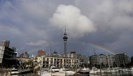 A rainbow appears on the Auckland skyline featuring Sky Tower in New Zealand, July 8, 2017. REUTERS/Jason Reed

