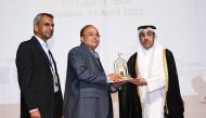 Minister of Labour H E Dr. Ali bin Smaikh Al Marri, with Galfar Al Misnad’s Executive Director Satish G Pillai and Senior General Manager Hemachandran during the award ceremony.