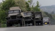 Military vehicles are see moving along a road, amid Russia's invasion of Ukraine, in the Donetsk region, Ukraine, May 31, 2022 REUTERS/Carlos Barria