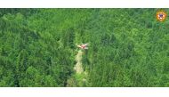 An Alpine Rescue helicopter flies over helicopter crash site near Pievepelago, Italy, June 11, 2022. 
