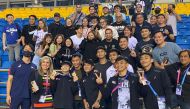 Carlos Yulo with his team-mates and fans at the Aspire Dome, yesterday.
