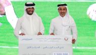 Minister of Sports and Youth H E Salah bin Ghanem Al Ali with Al Sadd CEO Turki Al Ali after the club won the Sports Excellence Award for the 2021-22 season.