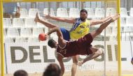 Qatar's Ahmad Murad Abdulrazzaq prepares to shoot during the match against Greece.