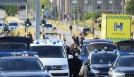 Police vehicles gather outside Fields shopping center, after Danish police said they received reports of a shooting at the site, in Copenhagen, Denmark, on July 3, 2022. (Reuters)