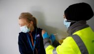 File photo: A woman receives vaccine against COVID-19 at a vaccination centre in Blackburn, Britain. (REUTERS/Jason Cairnduff)

