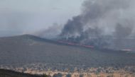 A view shows a wildfire burning from the Valmediano eolic park, on the second heatwave of the year, in Spain, July 19, 2022. REUTERS/Isabel Infantes/File Photo