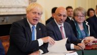 Prime Minister Boris Johnson, Chancellor of the Exchequer Nadhim Zahawi and Work and Pensions Secretary Therese Coffey attend a Cabinet meeting at 10 Downing Street, London, Britain, July 19, 2022. (Stefan Rousseau/Pool via REUTERS)