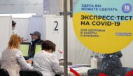 A medical specialist administers a nasal swab to a man at a COVID-19 rapid testing centre located at a metro station amid the outbreak of the coronavirus disease in Moscow, Russia November 9, 2021. REUTERS/Tatyana Makeyeva

