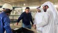 Minister of Environment and Climate Change H E Sheikh Dr. Faleh bin Nasser bin Ahmed bin Ali Al Thani during a visit to a recycling facility.