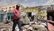 Residents look at the scene of an al Qaeda-linked al Shabaab group militant attack, in Mogadishu, Somalia August 21, 2022. Reuters/Feisal Omar
