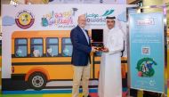 Doha Festival City’s General Manager Robert Hall awarding an official for the success of the 'Back to School' campaign.