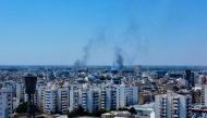 Smoke rises in the sky following clashes in Tripoli, Libya August 27, 2022. REUTERS/Hazem Ahmed