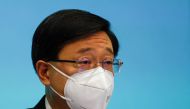 Chief Executive of Hong Kong John Lee speaks during a news conference over the shortened COVID-19 quarantine period, in Hong Kong, China, August 8, 2022. REUTERS/Tyrone Siu
