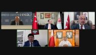 Minister of Commerce and Industry H E Sheikh Mohammed bin Hamad bin Qassim Al Thani with other officials taking part in the opening session of the Izmir Business Days Forum, virtually.