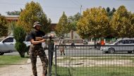 A Taliban fighter stands guard after a blast in front of the Russian embassy in Kabul, Afghanistan, September 5, 2022. Reuters/Ali Khara
