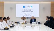  Qatari Amiri Naval Forces and HBKU officials during the signing of the agreement.