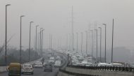 Vehicles are seen on a highway on a smoggy morning in New Delhi, India, December 2, 2021. REUTERS/Anushree Fadnavis/File Photo

