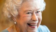 Britain's Queen Elizabeth reacts as she attends a reception in the Ballroom of Sandringham House which is the Queen's Norfolk residence, with representatives from local community groups to celebrate the start of the Platinum Jubilee, in Sandringham, Britain, February 5, 2022. Joe Giddens/ Pool via REUTERS/File Photo