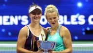 Czech Republic's Katerina Siniakova and Barbora Krejcikova celebrate with the trophy after winning the women's doubles final against Caty McNally and Taylor Townsend of the US.  Reuters/Mike Segar