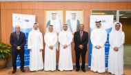 QSE’s Acting CEO Abdul Aziz Nasser Al Emadi and CCQ President Dr. Khalid Mohamed Al Horr, with other officials during the agreement signing ceremony, in Doha, yesterday. 