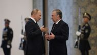 Russian President Vladimir Putin speaks with Uzbek President Shavkat Mirziyoyev during a meeting on the sidelines of the Shanghai Cooperation Organization (SCO) summit in Samarkand, Uzbekistan, on September 15, 2022. Sputnik/Sergey Bobylev/Pool via REUTERS