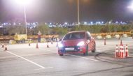 The podium winners of the Production Class 1 with Qatar Motor & Motorcycle Federation Executive Director Amro Al Hamad.