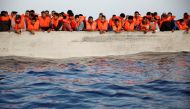 Migrants wait in a boat during a search and rescue operation by the NGO Proactiva Open Arms Uno rescue boat in central Mediterranean Sea, August, 17, 2022.  File Photo/Reuters
