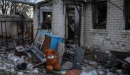 A stuffed toy is seen near a destroyed building in the village of Kamyanka, recently liberated by Ukrainian Armed Forces, in Kharkiv region, Ukraine September 22, 2022. REUTERS/Gleb Garanich
