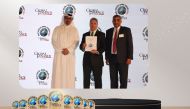 Commercial Bank’s EGM and Head of Wholesale Banking Raju Buddhiraju and EGM, Chief Marketing Officer and Head of Premium Banking Hussein Al Abdullah, during the awarding ceremony, recently. 