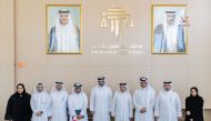 Chairman of the Investment and Trade Court Judge Khalid bin Ali Al Obaidli (fourth right), Managing Director of the Investment and Trade Court Maryam Sultan Khalifa Al Rabban (first right), QCPA president Dr. Hashim Al Sayed (fourth left), and QSE Chairman Eng. Khalid Al Nasser (third left) with other officials during signing of the MoUs.