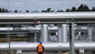 Security walks in front of the landfall facility of the Baltic Sea gas pipeline Nord Stream 2 in Lubmin, Germany, on September 19, 2022.  REUTERS/Fabrizio Bensch/File Photo