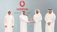 Minister of Labor H E Dr. Ali bin Saeed bin Smaikh Al Marri presents the award to Chief Human Resources Officer at Vodafone Qatar Khames Mohammed Alnaimi, during the awards ceremony, yesterday. 