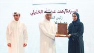 Minister of Labour H E Dr. Ali bin Smaikh Al Marri, presents the award to QIB Human Capital Group’s Head of Qatarisation Hind Al Khulaifi, in Doha, recently.