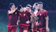 Umm Salal players celebrate.
