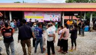 People gather outside of a daycare center's scene of a mass shooting. Sakdipat Boonsom/Handout via Reuters