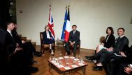 British Prime Minister Liz Truss, center left, poses with France's President Emmanuel Macron during a meeting on the sidelines of the European Political Community meeting at Prague Castle in Prague, Czech Republic on October 6, 2022.  Alastair Grant/Pool via REUTERS