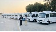 An official presents the key during the delivery of a large fleet of the County Bus in Doha, recently. 