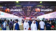 Visitors walk in front of the Huawei pavilion at GITEX GLOBAL 2022. 