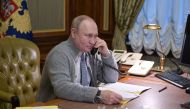 Russian President Vladimir Putin speaks on the phone during a conversation with a participant of a Christmas charity event in Strelna on the outskirts of Saint Petersburg, Russia, on December 27, 2021. File Photo / Reuters