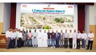 Officials pose for a group photo to celebrate the achievement of 1.5 Million Safe Man Hours without LTI for the Operations and Maintenance of MEP Services at Qatar University.