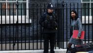 Britain's Secretary of State for the Home Department Suella Braverman walks outside Downing Street in London, Britain, on October 18, 2022. REUTERS/Henry Nicholls