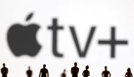Toy figures of people are seen in front of the displayed Apple TV + logo, in this illustration taken on January 20, 2022. File Photo / Reuters


