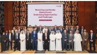 Officials and participants pose for a group photo.