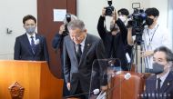 South Korea's Interior Minister Lee Sang-min bows (C) during a parliamentary session over the deadly Halloween crowd surge. Photo by Yonhap / AFP